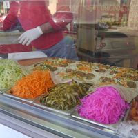 The ingredients and the making of 9 rolls at a time. at Sandwich Falafel W Bas in Aqaba