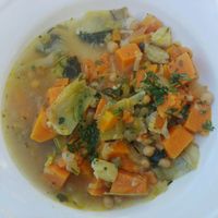 Organic and seasonal vegetable soup, artichoke, chickpea and pumpkin at El Quinto in Barcelona