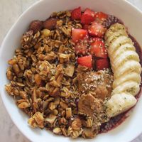 Pro Superberry bowl. A smoothie with cashew milk, pitaya, blueberries, strawberries, kale, avocado, spinach, dates, and vanilla extract topped with granola, banana, seasonal berries, almond butter, and hemp seeds. at Fruitive - Colley Ave in Norfolk