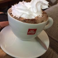 Hot chocolate with vegan cream and marshmallows underneath!  at Purple Cat Cafe in Glasgow