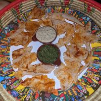 Entree dish - crispy injera with berbere, white lentil dip and spinach dip at Addis in Cape in Cape Town