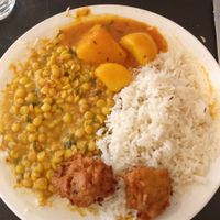 Potato curry and lentil daal with rice and onion pakoras at Kalpna in Edinburgh