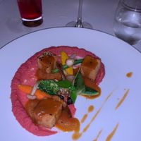 Chickpea cakes on a beet hummus with fresh blanched veggies topped with a AMAZINGLY TASTY sauce  at The Pepper Tree in Phu Quoc