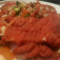 vegan veggie enchiladas with red sauce at Cacao Restaurant in Kansas City