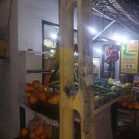 Fruit + books on sale at the roadside at Bookworm Library Restaurant in Hikkaduwa
