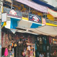 The entrance it's to the right next to where the guy is sitting at The Laughing Buddha Cafe in Pushkar