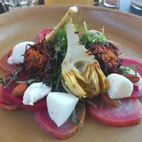 Smoked beetroot with vegan mozzarella, artichoke hearts and sweet potato fritters at Buitenplaats de Plantage in Vogelenzang