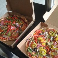 Two vegan pizzas to-go, topped with veggies at Pie Five Pizza in Washington