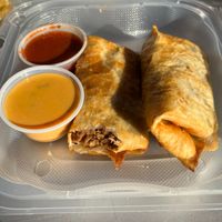 Vegan beef chimichanga with red and queso sauces at Nacho Taco in Jacksonville