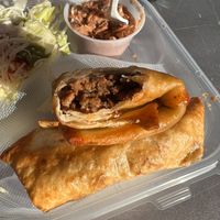 Vegan beef chimichanga with Mexican salad and refried beans at Nacho Taco in Jacksonville
