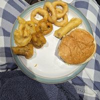 Left to right - battered mushrooms, onion rings, vegan battered sausage, vegan halloumi burger at Pennfields Plaice in Wolverhampton
