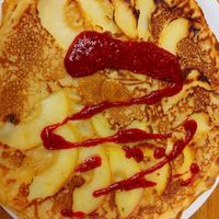 Apple dutch pancake with rasberry sauce at Pancakes - Prins Hendrikkade in Amsterdam