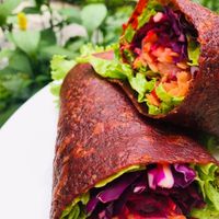 Colorful tomato wraps at La Bruja Vegan Foods in Antigua