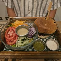 Seitan burger with salad at La Bruja Vegan Foods in Antigua