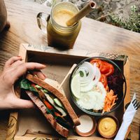 Vegan burger with eggplants steak, fresh garniture , homemade salade and tasty juice at La Bruja Vegan Foods in Antigua
