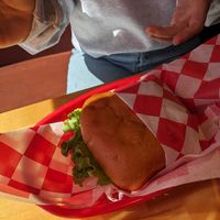 Deluxe hamburger with gluten free bun at Santana's Vegan Grill in Colorado Springs