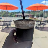 Oreo shake with outdoor seating in background at Santana's Vegan Grill in Colorado Springs
