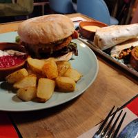 American burger, in the background El Gringo burrito. at Floripa in Barcelona