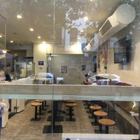 Inside of restaurant, showing utilitarian type seating at Xi'an Famous Foods - Upper East Side in New York City