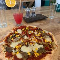The vegetale pizza and a Cinderella mocktail  at Green-Go Garden in Siem Reap