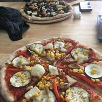 Pesto pizza and aubergine pizza at Green-Go Garden in Siem Reap