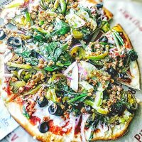 Veggie pizza with vegan cheese and vegan sausage crumbles. at PizzaRev in Shreveport