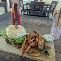 The spicy veggie burger with a side of chips and vegan sauce! yummmmmmy at Small Time Cooks in Abang