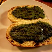 Bread with housemade vegan pesto at La Semilla in Puerto Maldonado