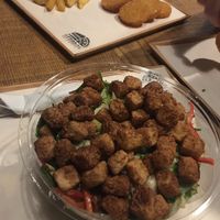 Crispy tofu salad with fries and potato rosti! Super tasty :) at Attaboy in Budapest