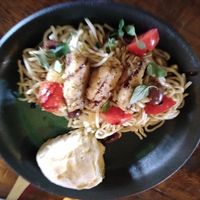 Homemade noodles with tomatoes and bell peppers. Roll at Baker Creek Heirloom Seed in Mansfield