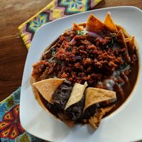 chilaquiles ahogados con chorizo vegano! at Bio & Natural - Quinta Avenida in Playa Del Carmen