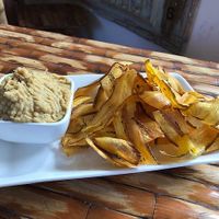 Plantain chips + Hummus at California Cafe  in Havana