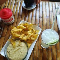 Hummus served with plantain chips and limonada frappe at California Cafe  in Havana