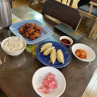 Sweet & spicy chicken with rice, veggie dumplings, radish kimchi, and pickled radish   at Oh Se Gae Hyang - 오세계향 in Seoul