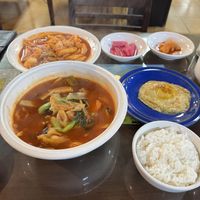Jjamppong (front left), tteokbokki (back left), fried egg (middle right), rice (front right), pickles and kimchi (back right)  at Oh Se Gae Hyang - 오세계향 in Seoul