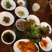 Table full of side dishes and Korean bbq at Oh Se Gae Hyang - 오세계향 in Seoul