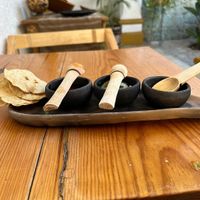 Chips, salsas Rojas y verdes with giardinera type mix at Hierba Dulce in Oaxaca