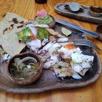 Tlayuda: special corn tortilla, black beans, tomatoes, avocado, lettuce at Hierba Dulce in Oaxaca