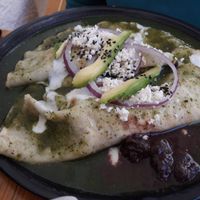 Enchiladas de hierba santa with almonds' vegan cream & cheese! at Hierba Dulce in Oaxaca