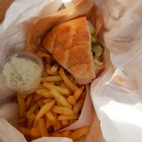 guacamole burger and fries with sauce at De Frietketel in Ghent