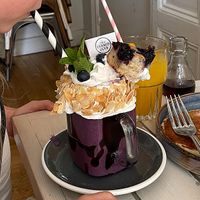 Blueberry milkshake has a piece of blueberry cake😄 at STHLM Brunch Club in Stockholm