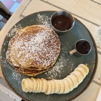 vegan pancakes with chocolate syrup and banana   at STHLM Brunch Club in Stockholm