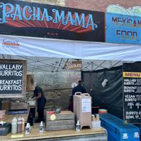 Pacha Mama’s cooked food stall at Hobart’s Farm Gate Market, offering a vegan burrito and vegan burrito bowl. at Farm Gate Market in Hobart