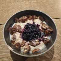 Oat porridge with milk, home made jam and dates at Bowl Market in Copenhagen