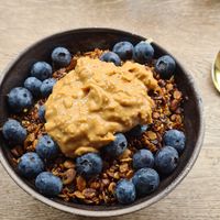 Porridge with blueberries Peanutbutter and Homemade Granola at Bowl Market in Copenhagen