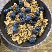 Massive bowl of oats with walnuts, chia, blueberries   at Bowl Market in Copenhagen