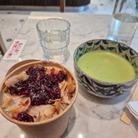 Coconut and raspberry porridge. Added some oat milk and was super delicious. (I'm sitting at another café in this pic) at Bowl Market in Copenhagen
