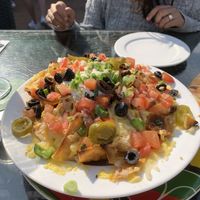Fully loaded nachos - huge with every topping you need! at Hemingway's By The Bay in Outlying Islands