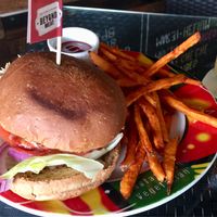 Beyond meat burger with sweet potato fries at Hemingway's By The Bay in Outlying Islands