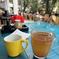 Cozy setting and Apple and cinnamon infusion  at Ira's Kitchen & Tea Room in Rishikesh